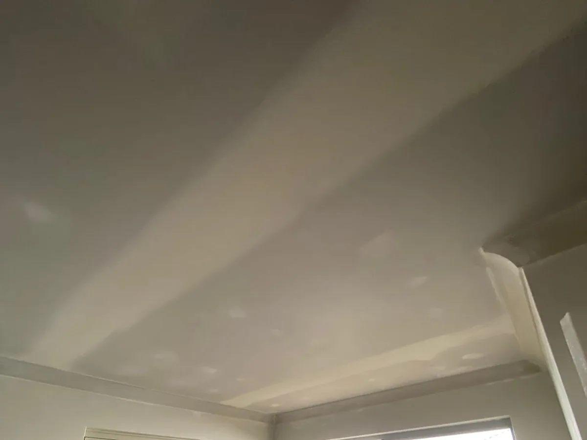 Ceiling resheeted and set in a laundry, cornice run refitted along the wall line