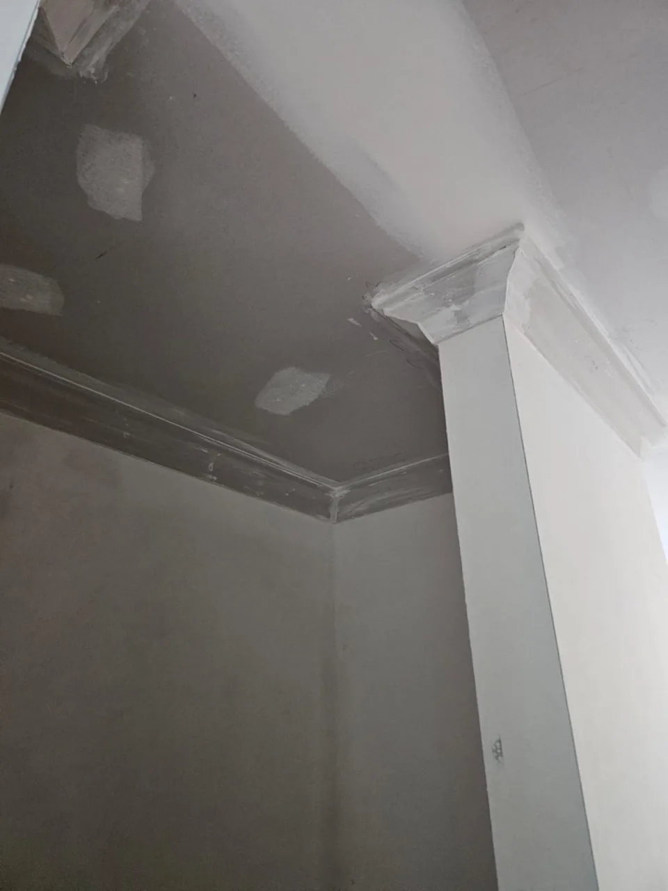 Close view of new Alto cornice meeting a plaster pilaster in a Roleystone house, the mitre cut clean
